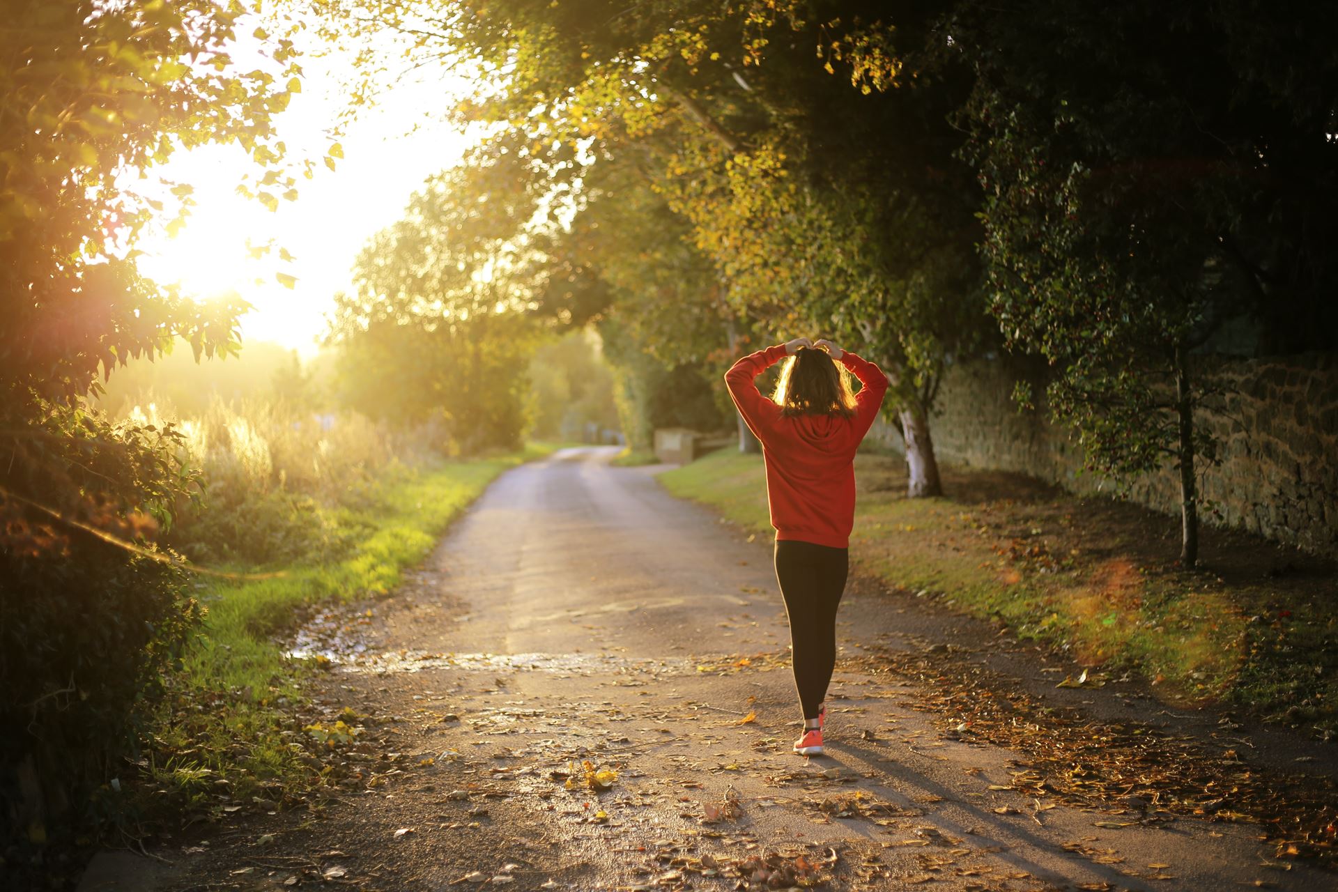 a person walking down a dirt road